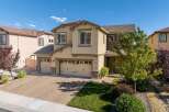 Discover this stunning two-story home featuring a spacious three-car garage and a beautifully paved driveway.