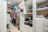 Discover an impeccably organized walk-in closet designed for modern living.