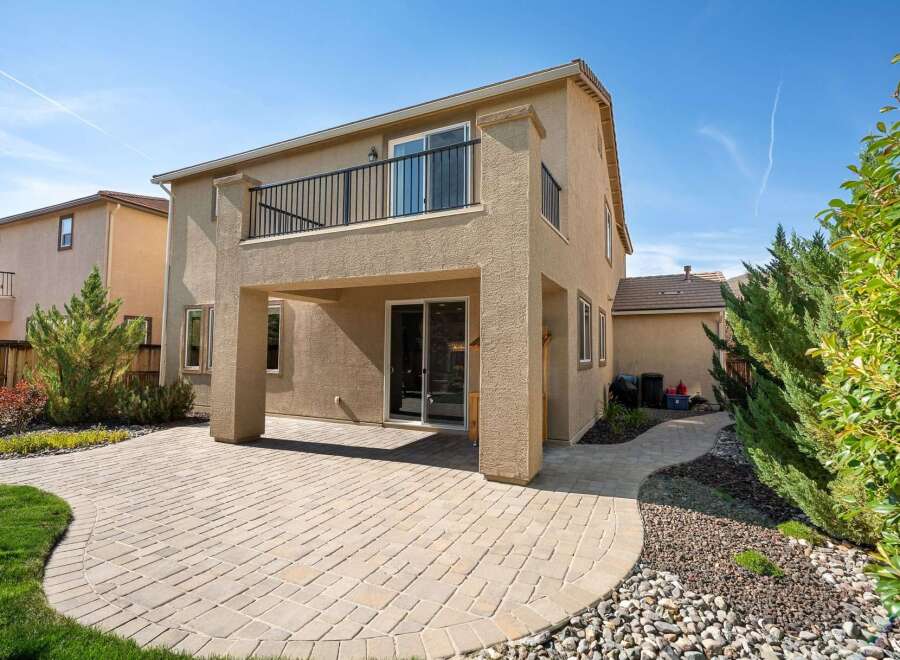 Enjoy outdoor living with this spacious backyard featuring a paved patio perfect for entertaining.
