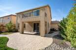 Enjoy outdoor living with this spacious backyard featuring a paved patio perfect for entertaining.