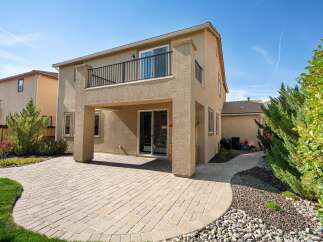 Enjoy outdoor living with this spacious backyard featuring a paved patio perfect for entertaining.