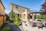 Enjoy outdoor living in this spacious backyard featuring a paved patio area perfect for entertaining.