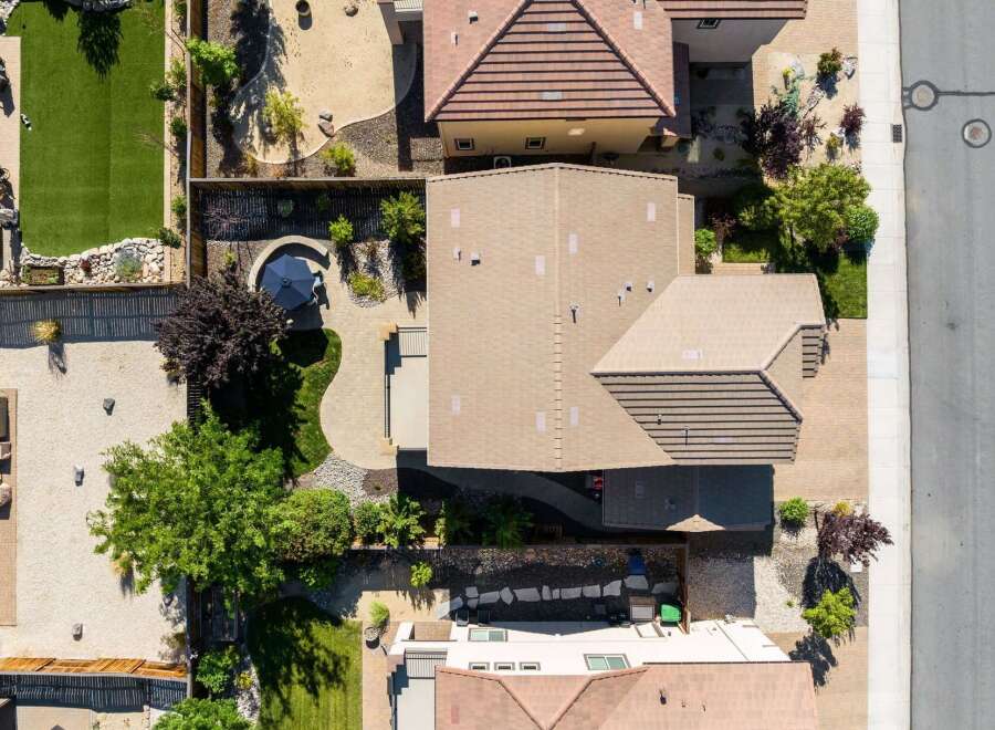 Experience luxury outdoor living with this stunning aerial view showcasing a beautifully landscaped backyard.