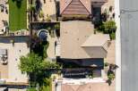 Experience luxury outdoor living with this stunning aerial view showcasing a beautifully landscaped backyard.