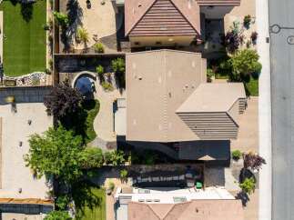 Experience luxury outdoor living with this stunning aerial view showcasing a beautifully landscaped backyard.