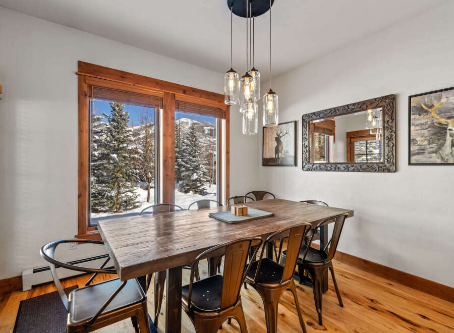 Experience breathtaking mountain views from this elegant dining room, perfect for hosting memorable gatherings.