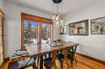 Experience breathtaking mountain views from this elegant dining room, perfect for hosting memorable gatherings.