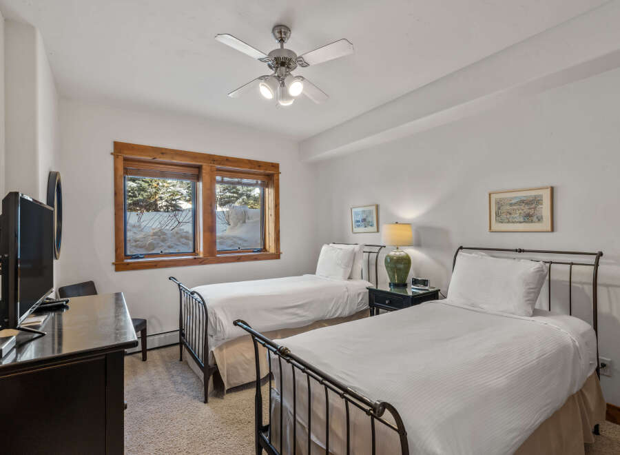 This charming bedroom features two comfortable twin beds, perfect for accommodating guests or family.