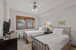 This charming bedroom features two comfortable twin beds, perfect for accommodating guests or family.