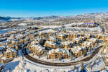 Experience luxury mountain living in this stunning ski resort community, featuring charming chalets and condos blanketed in fresh snow.