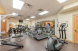 This well-equipped gym features a variety of cardio machines including treadmills and ellipticals, perfect for maintaining your fitness routine.