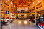 Experience the ultimate automotive enthusiast's dream in this stunning timber-frame garage.