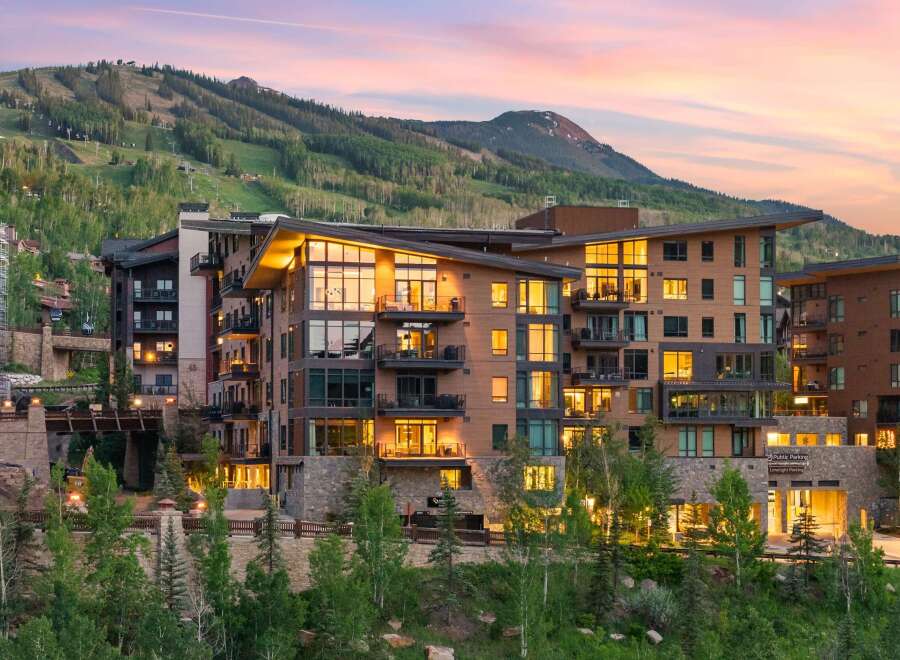 Experience luxury mountain living in this stunning property, featuring modern architecture with warm wood accents and expansive windows that capture breathtaking views.