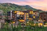 Experience luxury mountain living in this stunning property, featuring modern architecture with warm wood accents and expansive windows that capture breathtaking views.