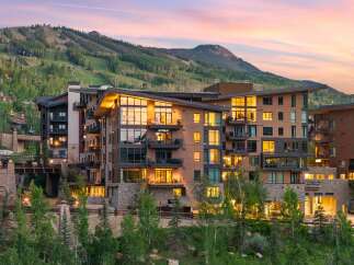 Experience luxury mountain living in this stunning property, featuring modern architecture with warm wood accents and expansive windows that capture breathtaking views.
