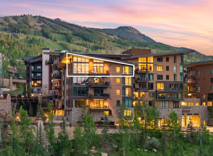 Experience luxury mountain living in this stunning property, featuring modern architecture with warm wood accents and expansive windows that capture breathtaking views.