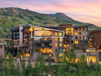 Experience luxury mountain living in this stunning property, featuring modern architecture with warm wood accents and expansive windows that capture breathtaking views.