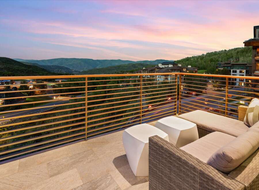 Experience breathtaking mountain views from this stunning balcony, perfect for enjoying serene sunsets.