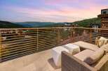 Experience breathtaking mountain views from this stunning balcony, perfect for enjoying serene sunsets.
