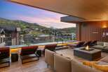 Experience luxury mountain living with this stunning rooftop deck, featuring a private hot tub and a cozy fire pit, perfect for enjoying breathtaking sunset views over the ski resort.