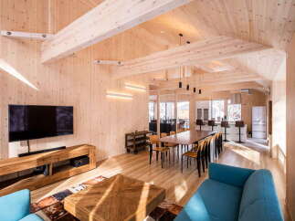 Experience modern living in this stunning timber-framed home, featuring an open-concept living and dining area perfect for entertaining.