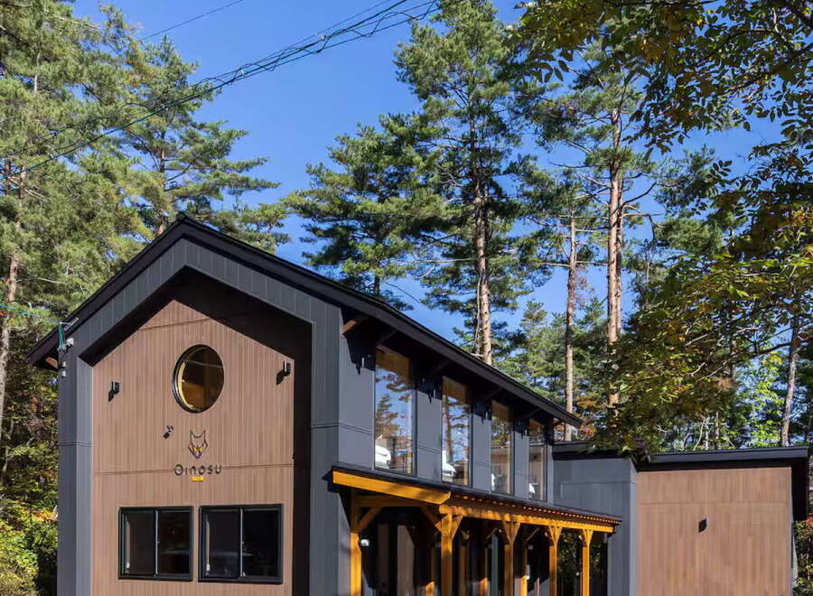 Discover this modern architectural gem nestled amidst lush greenery.