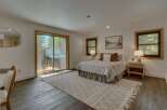 Experience ultimate relaxation in this serene bedroom featuring a luxurious hot tub accessible directly from the room.