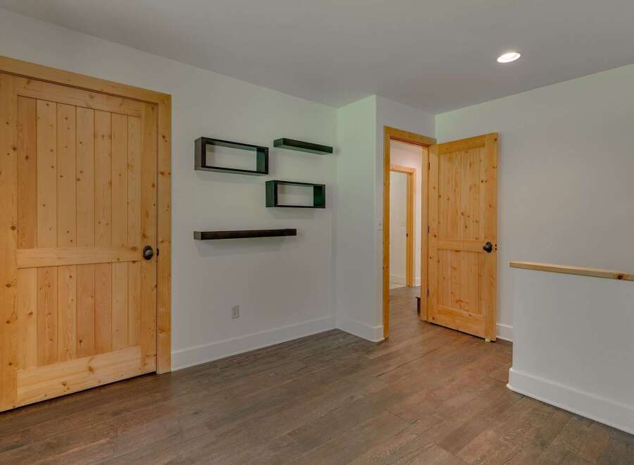 Step into a warm and inviting space featuring beautiful natural wood doors and flooring.