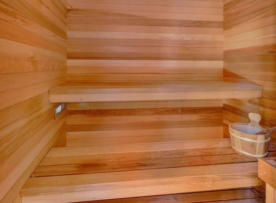 Experience ultimate relaxation in this beautifully crafted wooden sauna.