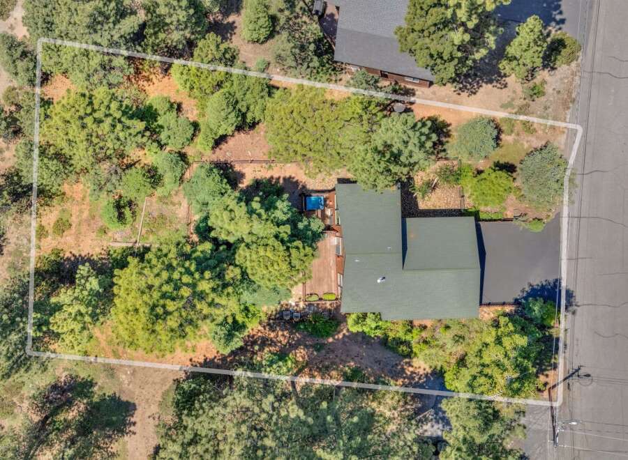 Discover this charming property featuring a spacious deck with a relaxing hot tub, perfect for unwinding.