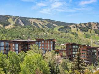 Experience luxury mountain living in this stunning contemporary property, nestled against a backdrop of ski slopes and lush green forests.
