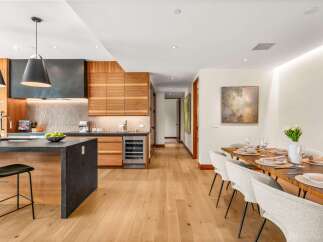 Experience modern luxury in this stunning open-concept kitchen and dining area.