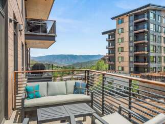 Experience breathtaking mountain views from this stunning balcony, perfect for enjoying your morning coffee or evening relaxation.