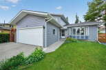 Charming single-family home featuring a spacious two-car garage and a welcoming front entrance.