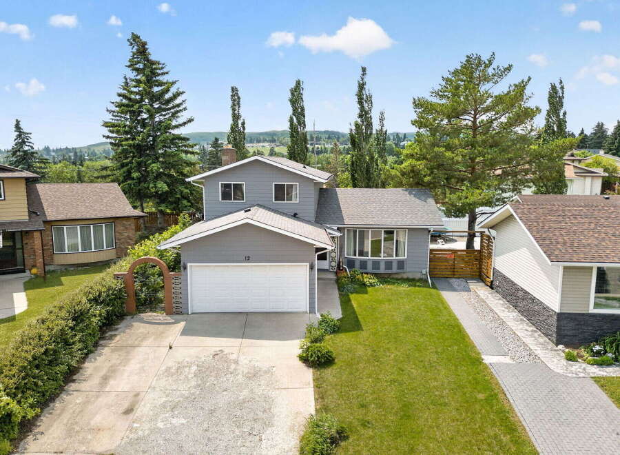Discover this charming two-story home featuring a spacious two-car garage and a beautifully landscaped front yard.