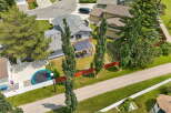 Discover this charming home featuring a spacious backyard with a trampoline, perfect for outdoor fun.
