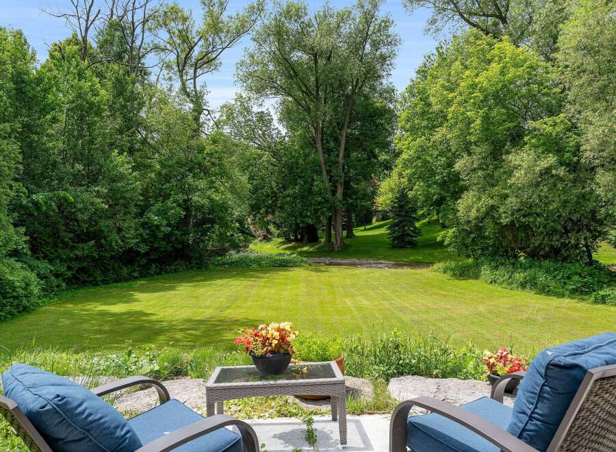 Enjoy the serene beauty of this expansive backyard, perfect for outdoor relaxation and entertaining.
