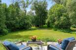 Enjoy the serene beauty of this expansive backyard, perfect for outdoor relaxation and entertaining.
