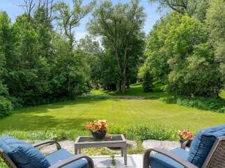Enjoy the serene beauty of this expansive backyard, perfect for outdoor relaxation and entertaining.