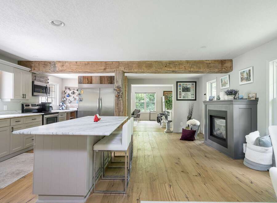 Experience modern living in this open-concept home featuring a stunning marble-topped island perfect for entertaining.