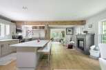 Experience modern living in this open-concept home featuring a stunning marble-topped island perfect for entertaining.