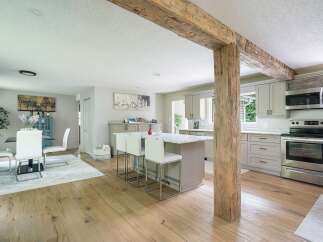 Experience the perfect blend of rustic charm and modern convenience in this beautifully renovated kitchen and dining area.