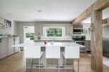 Experience the perfect blend of modern elegance and rustic charm in this stunning kitchen.