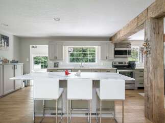 Experience the perfect blend of modern elegance and rustic charm in this stunning kitchen.
