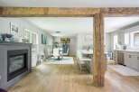 Experience the perfect blend of rustic charm and modern elegance in this open-concept living space.