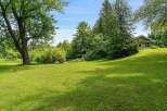 Discover this charming home nestled on a picturesque, tree-lined lot.
