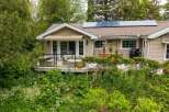 Enjoy outdoor living at its finest with this charming home featuring a spacious deck perfect for entertaining.