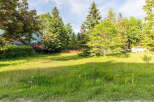 Discover this charming property featuring a spacious, sun-drenched yard perfect for outdoor activities and relaxation.