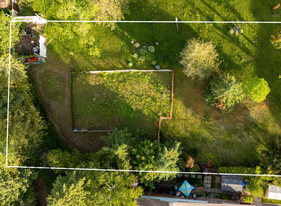 Discover this spacious backyard, perfect for outdoor living and entertaining.