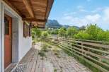 Enjoy the serene mountain views from the covered patio of this charming property.